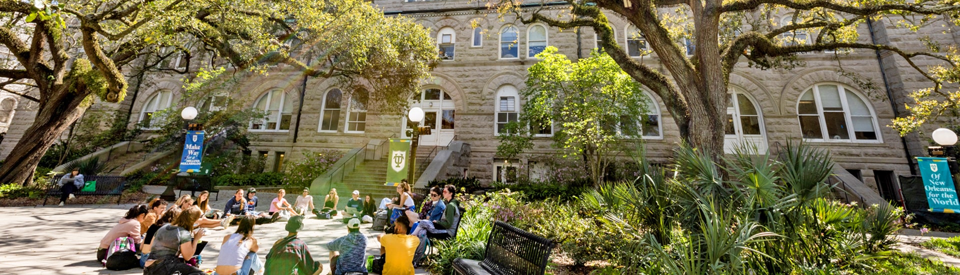 Tulane students sit in a circle outside of Gibson Hall